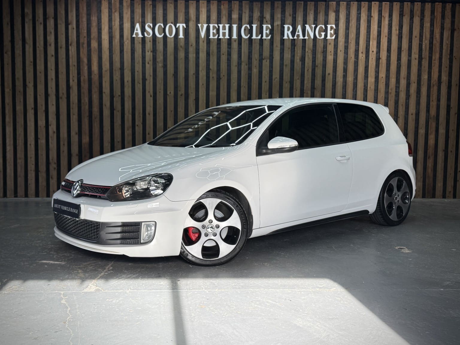 2010 Volkswagen Golf 2.0 TSI GTI in white — photo 1 of 50